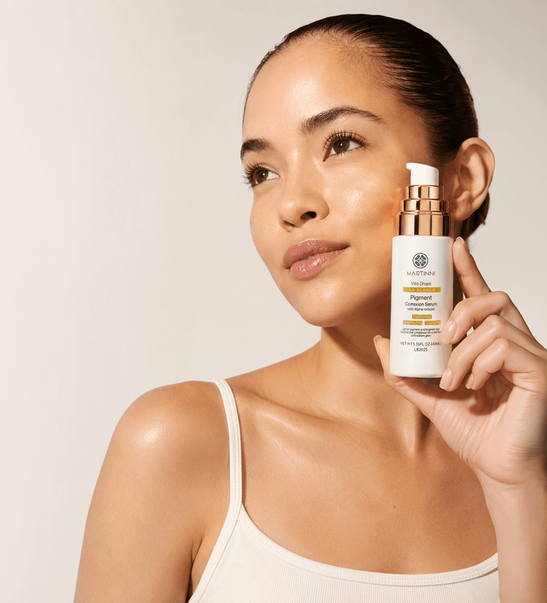 Model holding a professional brightening serum
