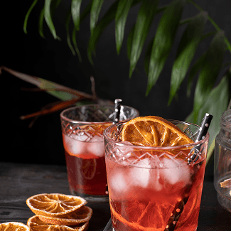 Vita Blu cocktail with ice and citrus garnish