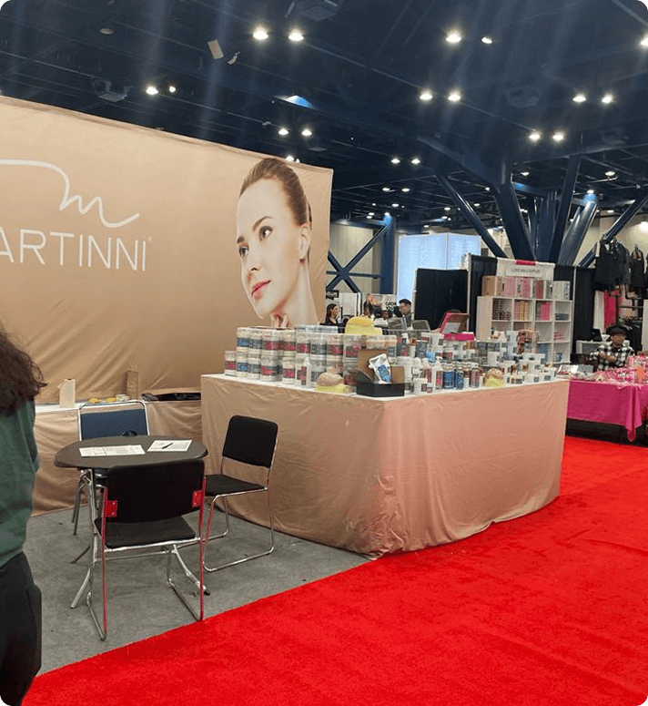Elore and Martinni Beauty product display at an industry tradeshow